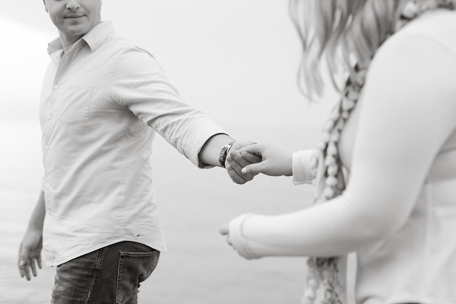 Holding hands at Scarborough Bluff engagement session