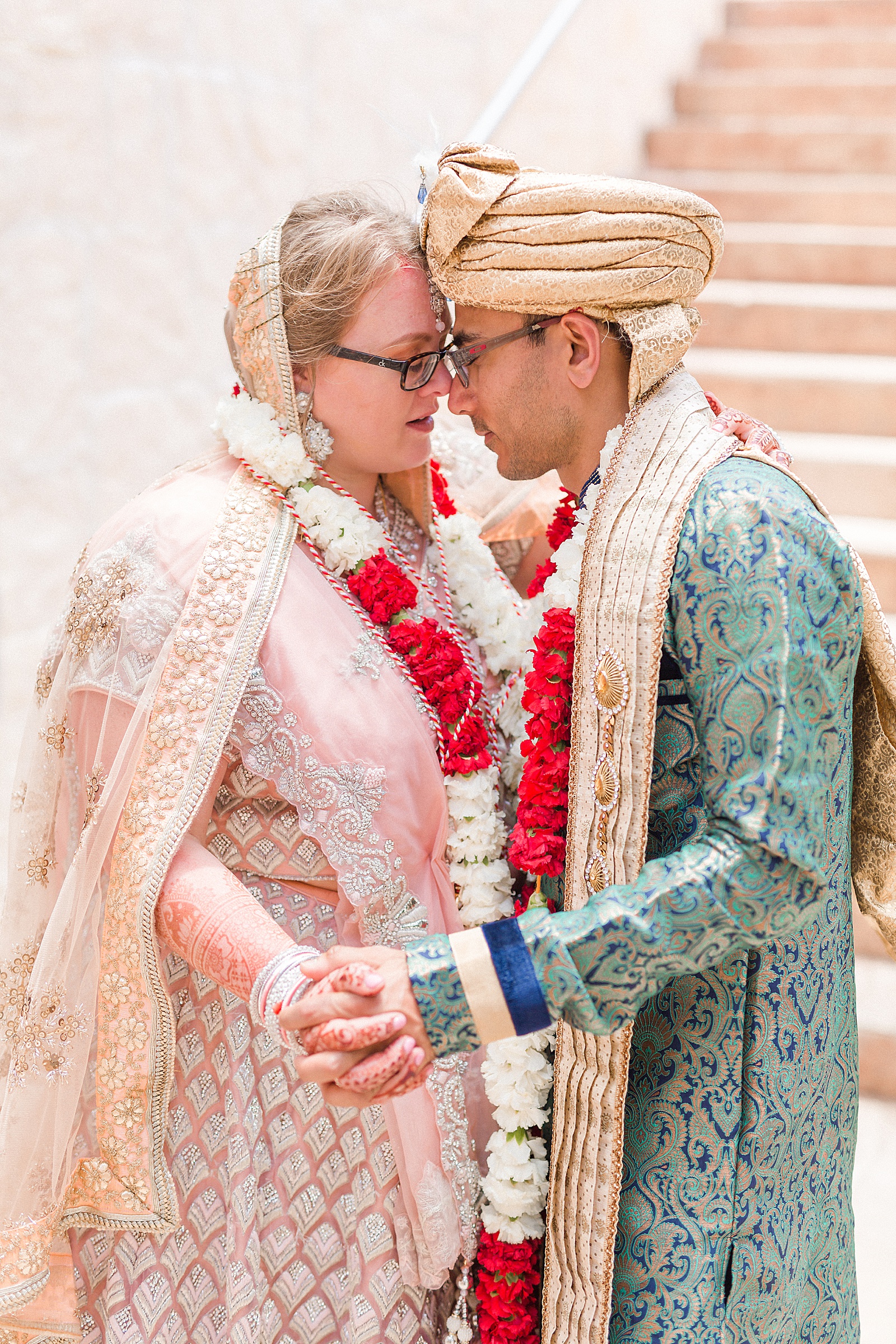 Bride and Groom dancing in Indian ceremony apparel